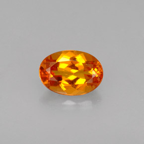 Clinohumite Naranja amarillo natural de 0.56 ct, Corte Óvalo, VS
