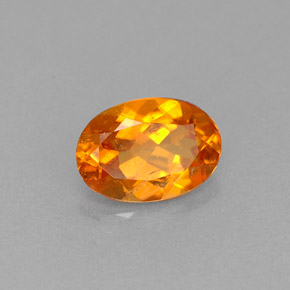 Clinohumite Naranja amarillo natural de 0.66 ct, Corte Óvalo, VS-SI