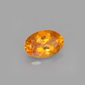Clinohumita naranja natural de 0,61 ct, corte óvalo, VS-SI