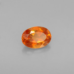 Clinohumite Naranja amarillo natural de 0.64 ct, Corte Óvalo, VS-SI