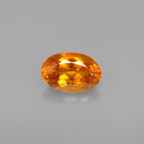 Clinohumite Naranja amarillo natural de 0.64 ct, Corte Óvalo, VS-SI