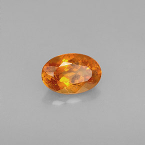 Clinohumite Naranja amarillo natural de 0.64 ct, Corte Óvalo, VS-SI