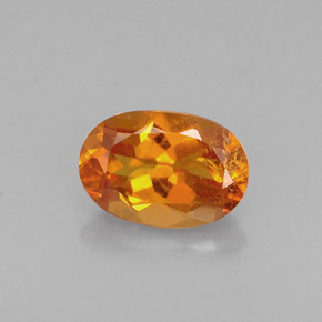 Clinohumite Naranja amarillo natural de 0.60 ct, Corte Óvalo, VS-SI