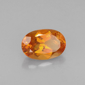 Clinohumite Naranja amarillo natural de 0.60 ct, Corte Óvalo, VS-SI