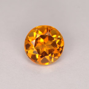 Clinohumite Naranja amarillo natural de 0.71 ct, Corte Redondo, VS