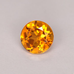 Clinohumite Naranja amarillo natural de 0.71 ct, Corte Redondo, VS