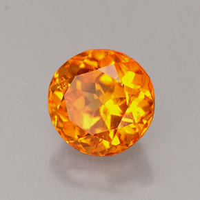 Clinohumite Naranja amarillo natural de 0.89 ct, Corte Redondo, VS-SI