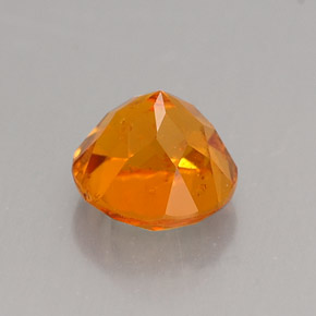 Clinohumite Naranja amarillo natural de 0.89 ct, Corte Redondo, VS-SI