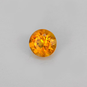 Clinohumite Naranja amarillo natural de 0.60 ct, Corte Redondo, VS-SI