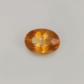 Clinohumite naranja amarillo natural de 0,77 ct, corte óvalo, VS