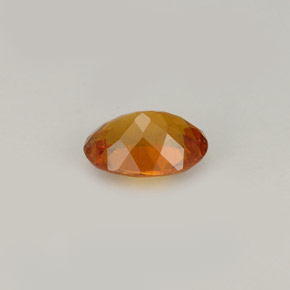 Clinohumite naranja amarillo natural de 0,77 ct, corte óvalo, VS