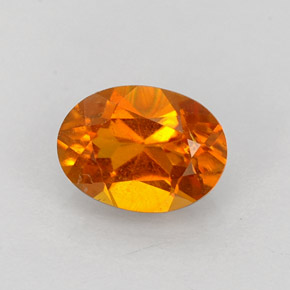 Clinohumite Naranja amarillo natural de 0.84 ct, Corte Óvalo, VS-SI