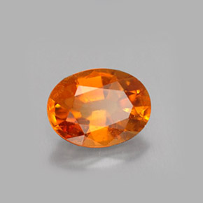 Clinohumite Naranja amarillo natural de 1.47 ct, Corte Óvalo, VS-SI