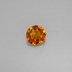 Clinohumite Naranja amarillo natural de 0.63 ct, Corte Redondo, VS-SI