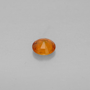 Clinohumite Naranja amarillo natural de 0.63 ct, Corte Redondo, VS-SI