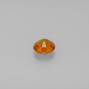 Clinohumite Naranja amarillo natural de 0.64 ct, Corte Redondo, SI