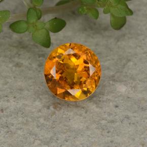 Clinohumite Naranja amarillo natural de 0.62 ct, Corte Redondo, VS-SI