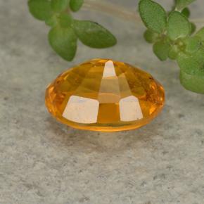 Clinohumita naranja natural de 0,84 ct, corte óvalo, VS-SI