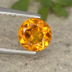 Clinohumite Naranja amarillo natural de 0.80 ct, Corte Redondo, VS-SI