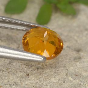 Clinohumite Naranja amarillo natural de 0.80 ct, Corte Redondo, VS-SI