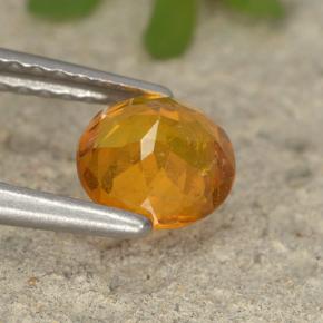 Clinohumite Naranja amarillo natural de 0.86 ct, Corte Redondo, VS-SI