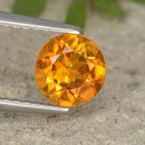 Clinohumite Naranja amarillo natural de 0.87 ct, Corte Redondo, VS-SI