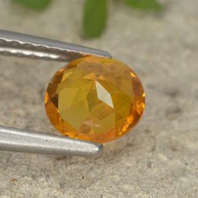 Clinohumite Naranja amarillo natural de 0.87 ct, Corte Redondo, VS-SI