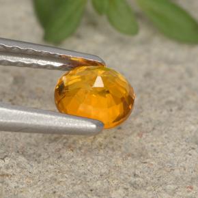 Clinohumite Naranja amarillo natural de 0.41 ct, Corte Óvalo, VS-SI