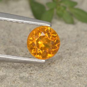 Clinohumite Naranja amarillo natural de 0.63 ct, Corte Redondo, VS-SI