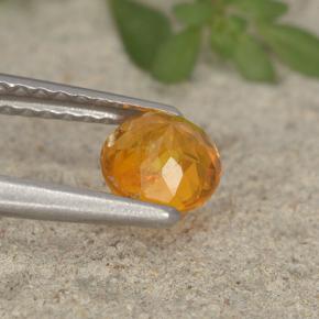 Clinohumite Naranja amarillo natural de 0.63 ct, Corte Redondo, VS-SI