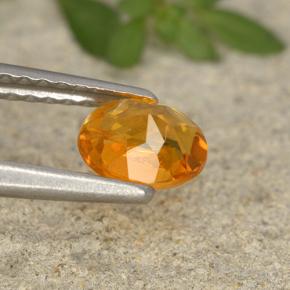 Clinohumita naranja natural de 0,62 ct, corte óvalo, VS-SI