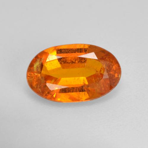 Clinohumite Naranja rojizo natural de 1.42 ct, Corte Óvalo, VS-SI