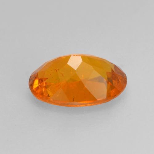 Clinohumita naranja natural de 0,82 ct, corte óvalo, SI
