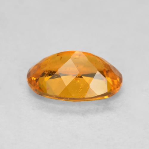 Clinohumita naranja natural de 0,85 ct, corte óvalo, SI-I1