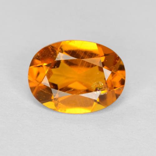 Clinohumite Naranja oscuro natural de 0.89 ct, Corte Óvalo, SI