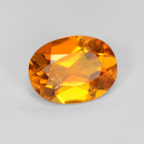 Clinohumite Naranja oscuro natural de 0.89 ct, Corte Óvalo, SI