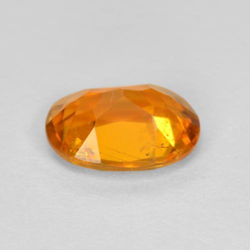 Clinohumite Naranja oscuro natural de 0.89 ct, Corte Óvalo, SI