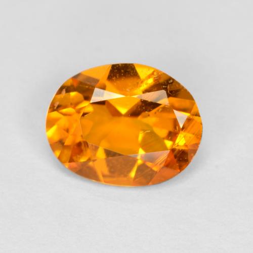 Clinohumita naranja natural de 0,68 ct, corte óvalo, SI