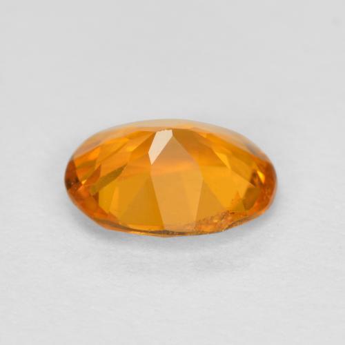 Clinohumita naranja natural de 0,68 ct, corte óvalo, SI