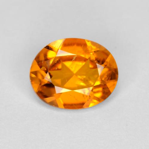 Clinohumita naranja natural de 0,54 ct, corte óvalo, SI