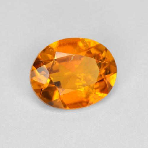 Clinohumita naranja natural de 0,54 ct, corte óvalo, SI