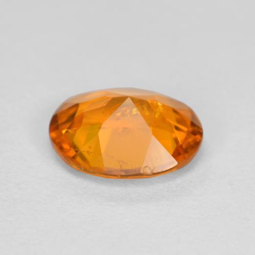 Clinohumita naranja natural de 0,54 ct, corte óvalo, SI