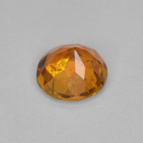 Clinohumita naranja medio natural de 0,63 ct, corte redondo, SI