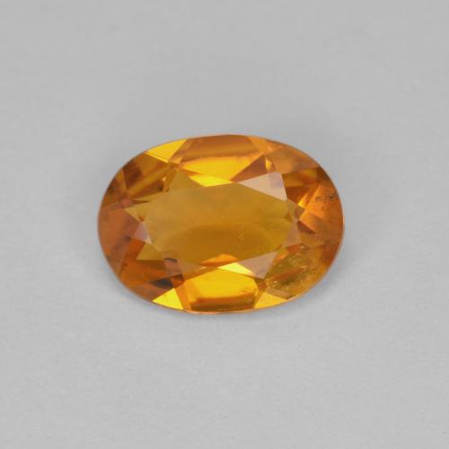 Clinohumita naranja natural de 0,90 ct, corte óvalo, VS-SI