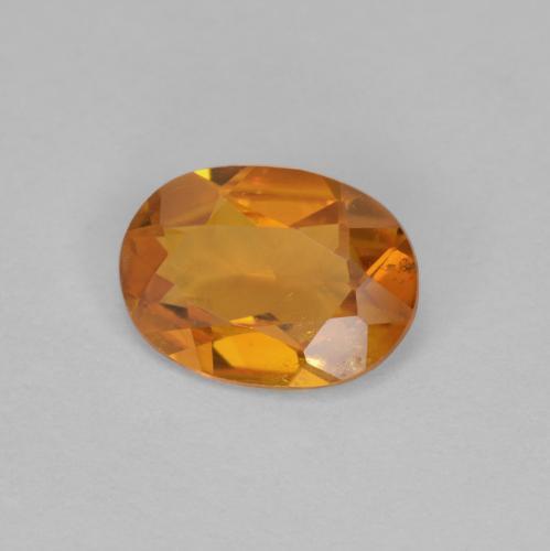 Clinohumita naranja natural de 0,90 ct, corte óvalo, VS-SI