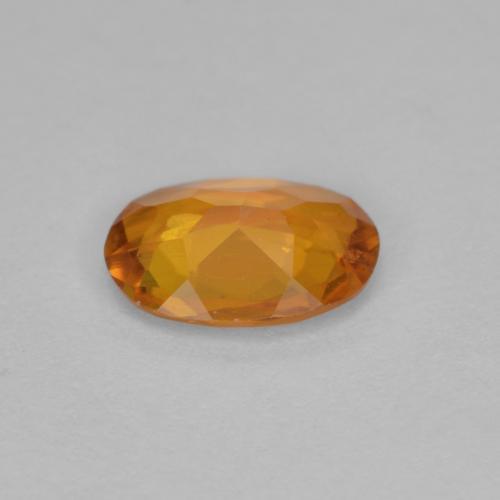 Clinohumita naranja natural de 0,90 ct, corte óvalo, VS-SI
