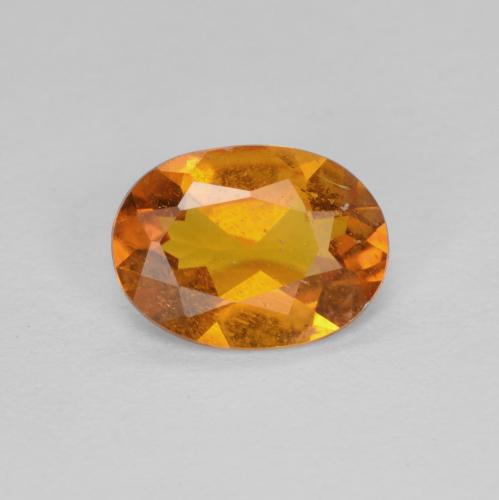 Clinohumita naranja natural de 0,94 ct, corte óvalo, SI