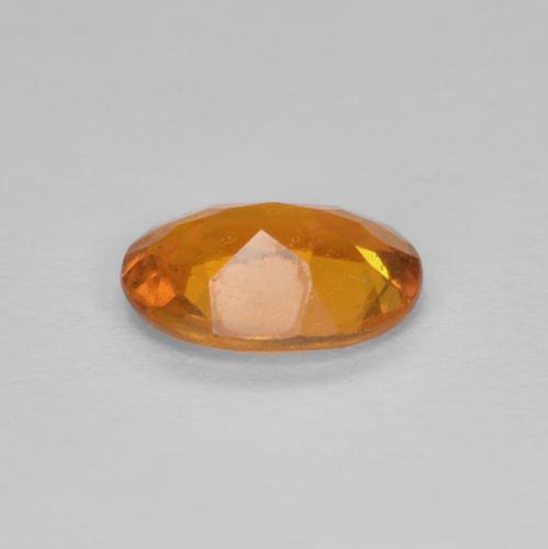 Clinohumita naranja natural de 0,94 ct, corte óvalo, SI