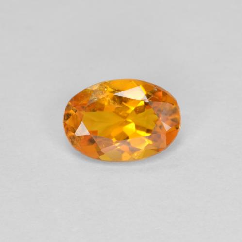 Clinohumite Naranja albaricoque natural de 0.60 ct, Corte Óvalo, SI