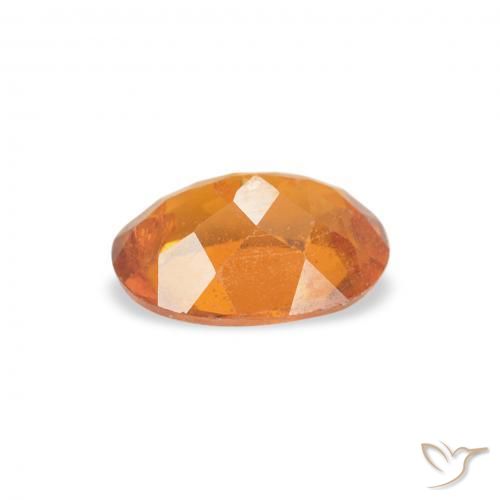 Clinohumite Naranja rojizo natural de 0.76 ct, Ovalada, SI
